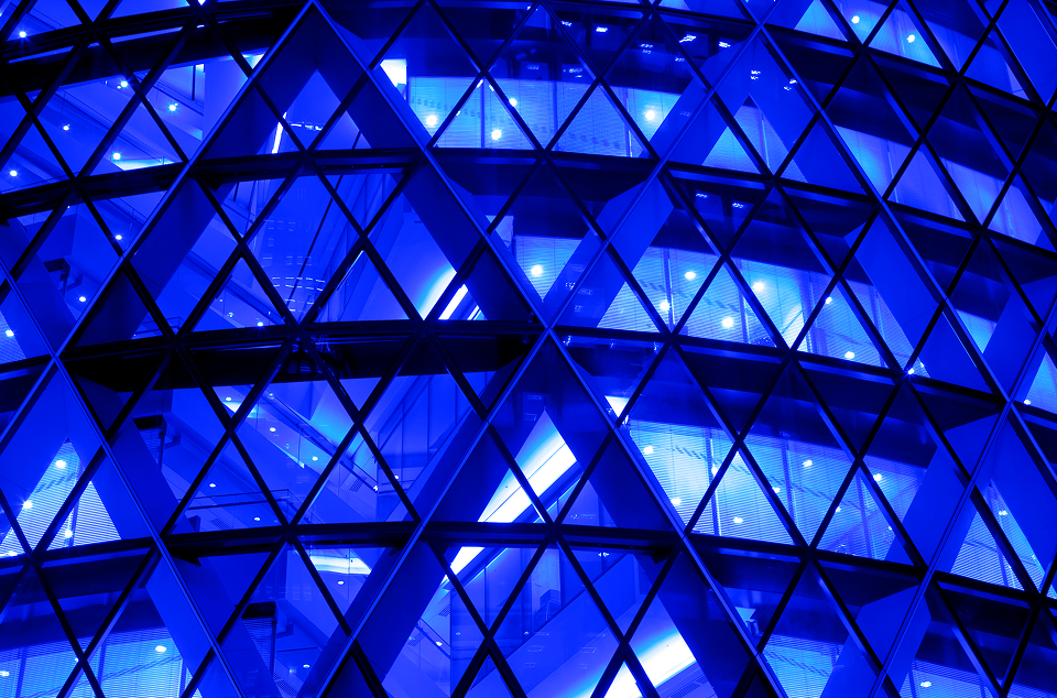 blue business building with triangular windows