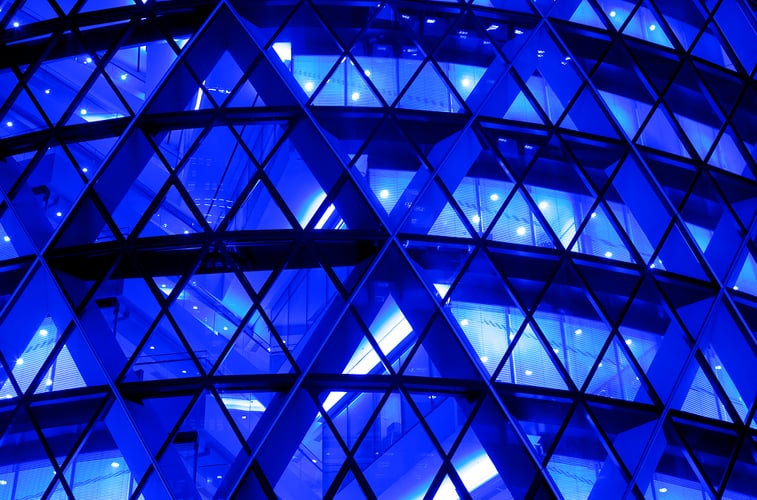blue business building with triangular windows