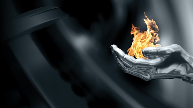 Outokump hand with fire