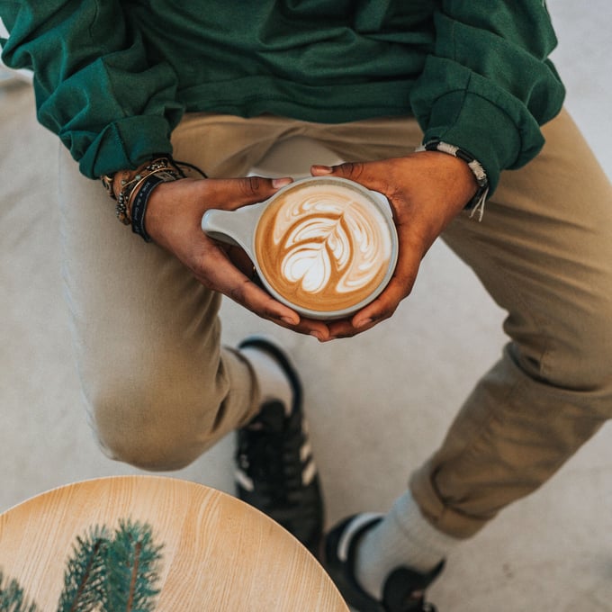 man holding coffee mug