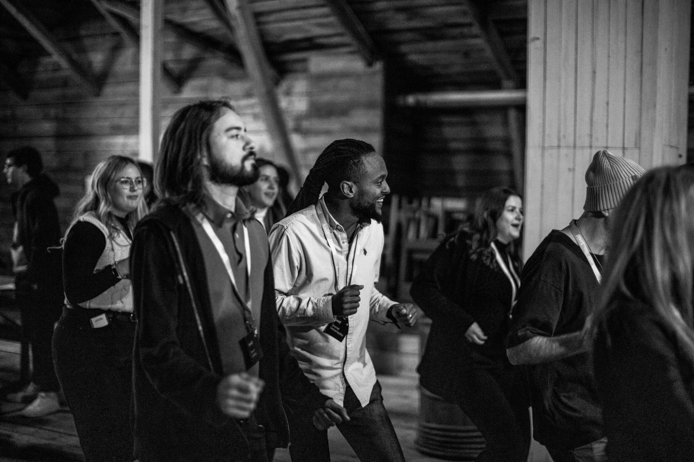 group luxid employees dancing in barn