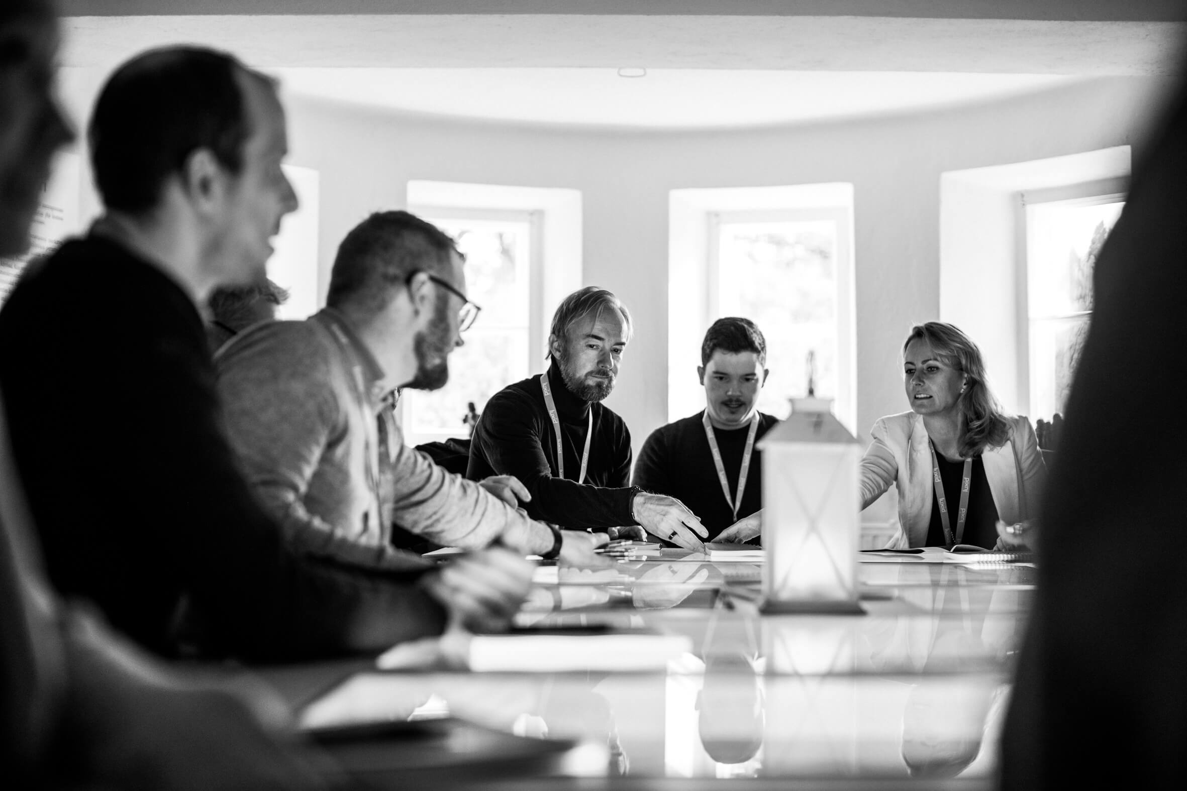 team-meeting-around-table-black-and-white