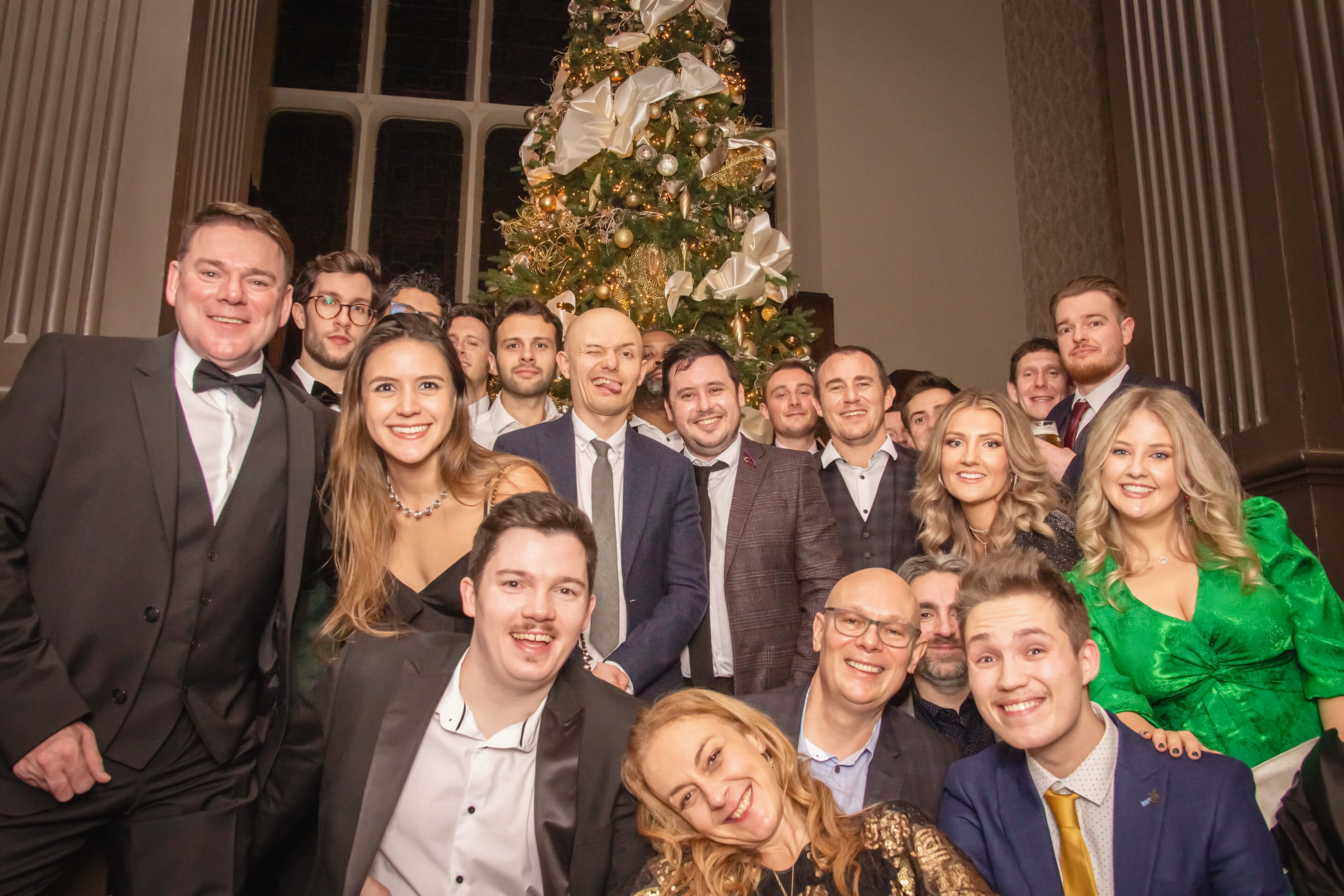 london-team-festive-photo-with-christmas-tree