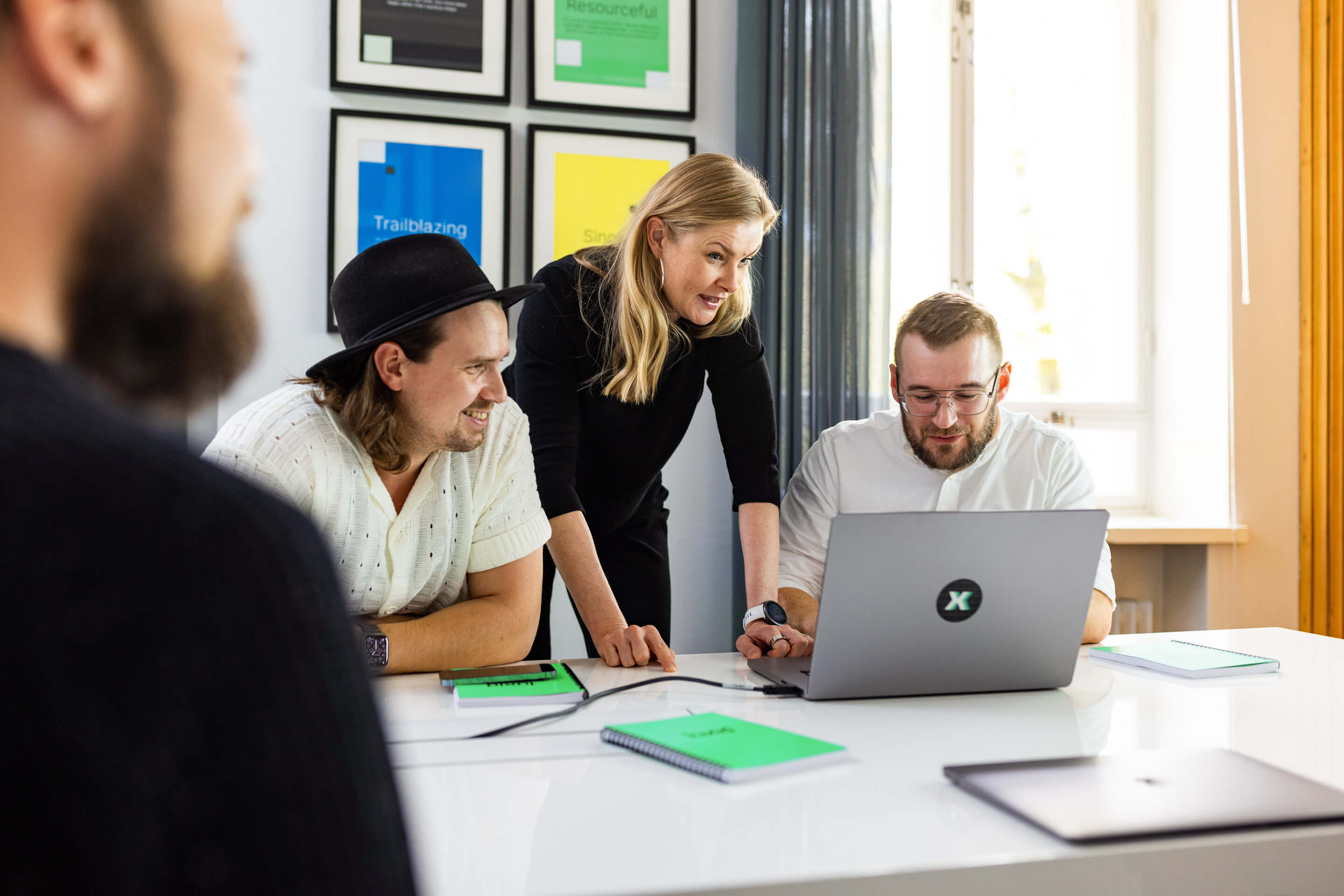 Team working in office looking at computer