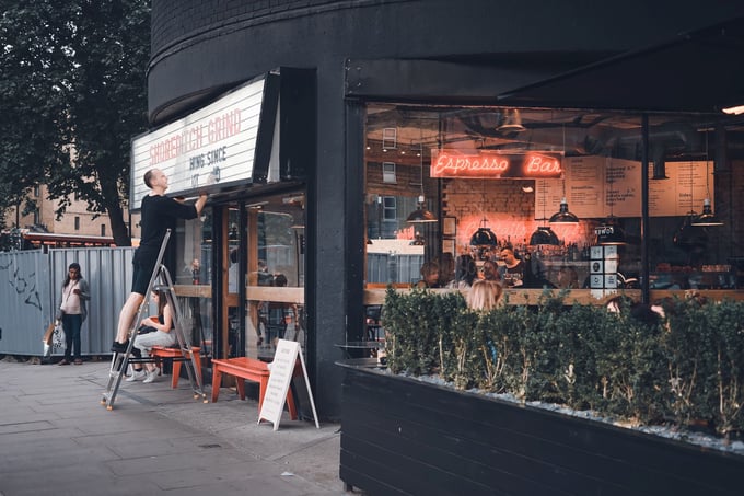 shopkeeper sign update cafe toa-heftiba-fbaoc5z0F4U-unsplash_1920